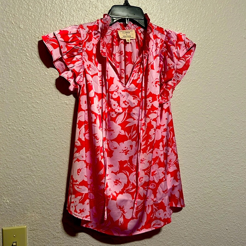 Flower & Feather pink top with flowers.